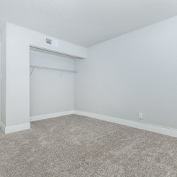 Secondary carpeted bedroom with closet at Stone Canyon Apartments, located in Colorado Springs, CO